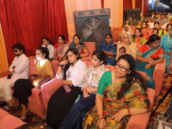 Families seated on sofas watching a music programme at Amartarangini, Haridwar